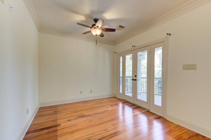 122 Vieux Carre Drive Houston, TX 77009 - Photo 27 of 47 a view of an empty room with wooden floor and a window