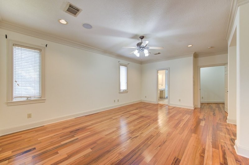 122 Vieux Carre Drive Houston, TX 77009 - Photo 28 of 47 a view of an empty room with wooden floor and a window