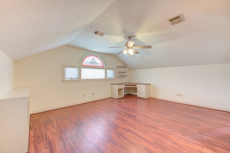 122 Vieux Carre Drive Houston, TX 77009 - Photo 39 of 47 an empty room with wooden floor and windows