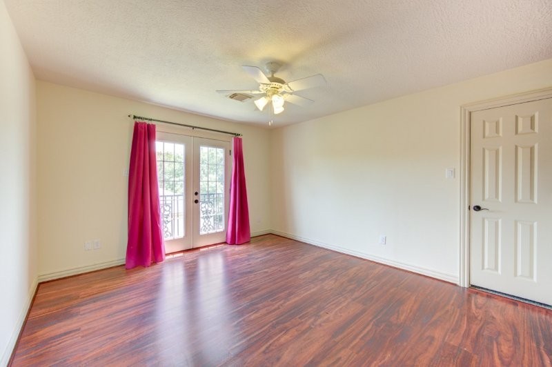 122 Vieux Carre Drive Houston, TX 77009 - Photo 41 of 47 a view of an empty room with window and wooden floor