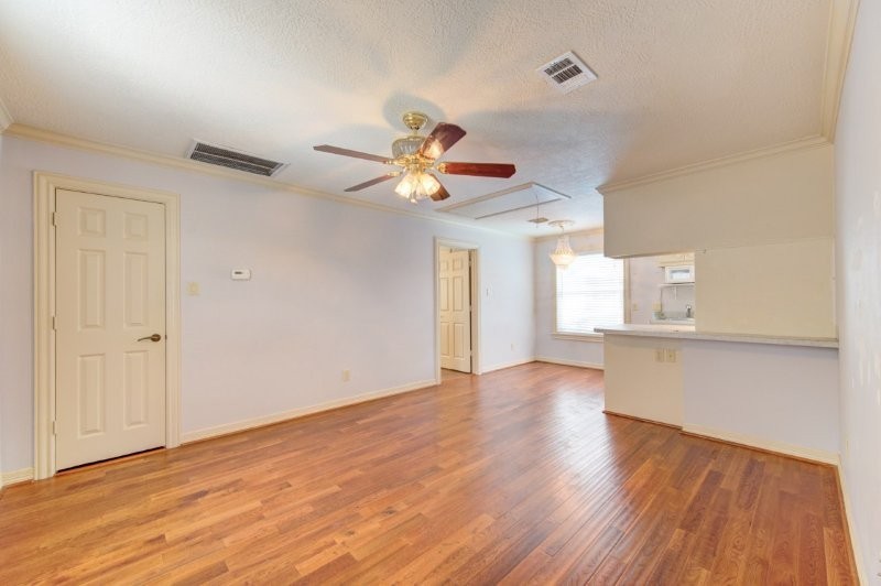 122 Vieux Carre Drive Houston, TX 77009 - Photo 44 of 47 a view of an empty room with wooden floor and a window