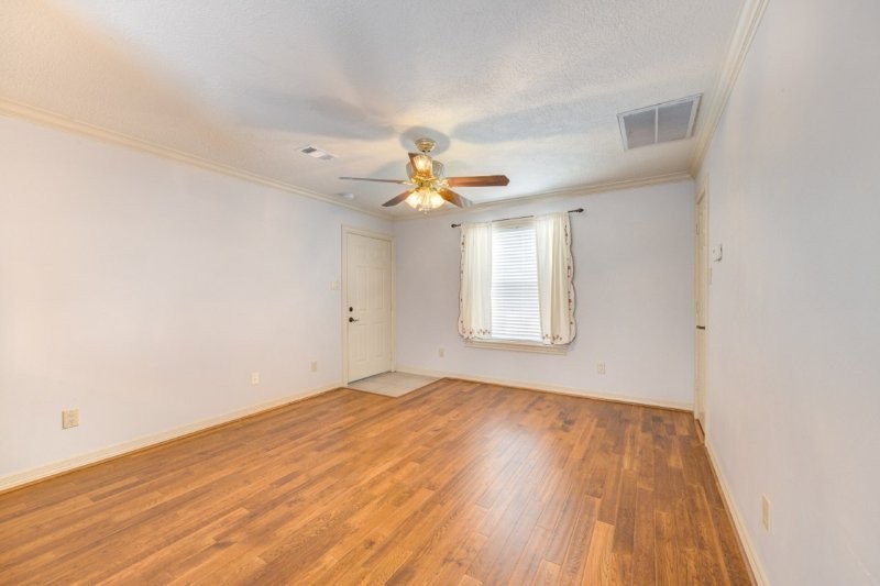 122 Vieux Carre Drive Houston, TX 77009 - Photo 46 of 47 a view of empty room with wooden floor and fan