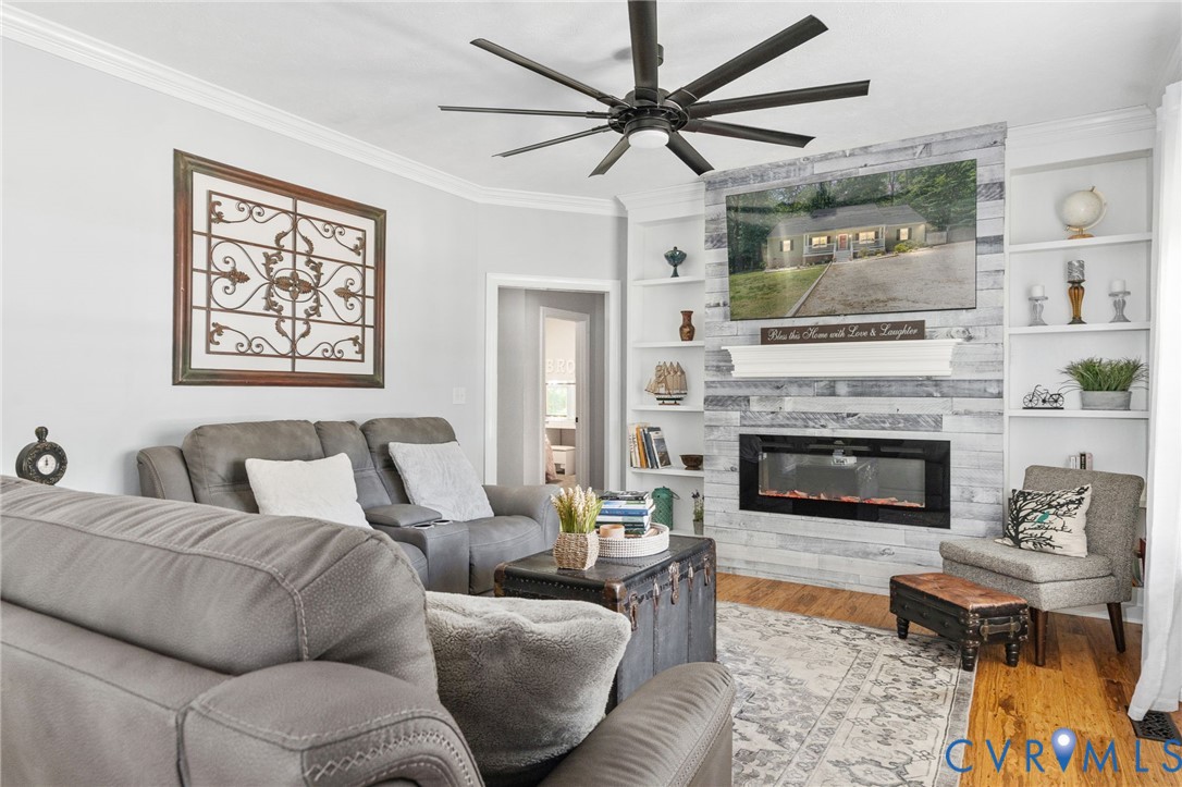 1755 Dispatch Road Quinton, VA 23141 - Photo 12 of 86 a living room with furniture a fireplace and a large window