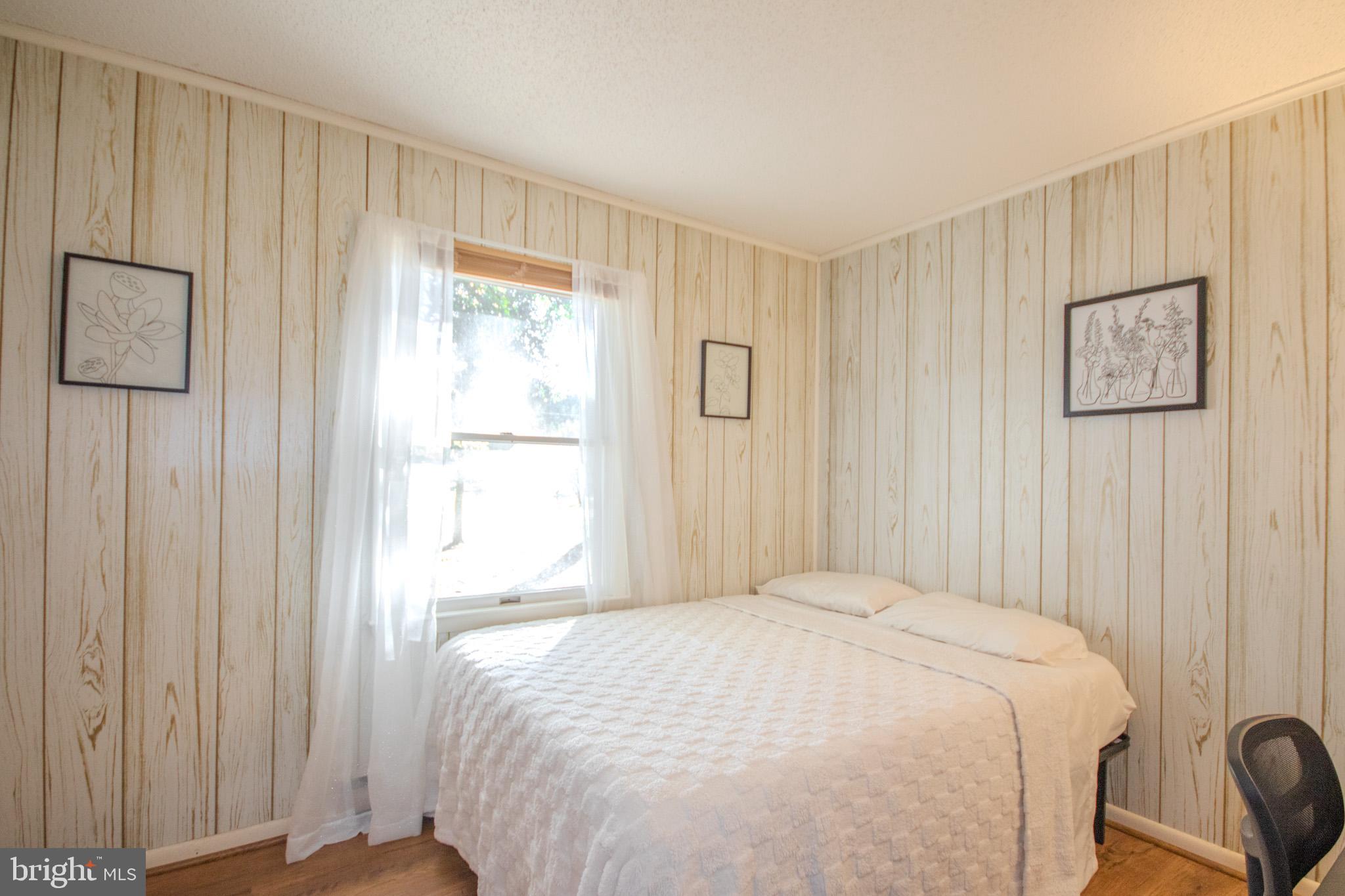 7218 Walston Switch Road Parsonsburg, MD 21849 - Photo 11 of 28 a bedroom with a bed and a window