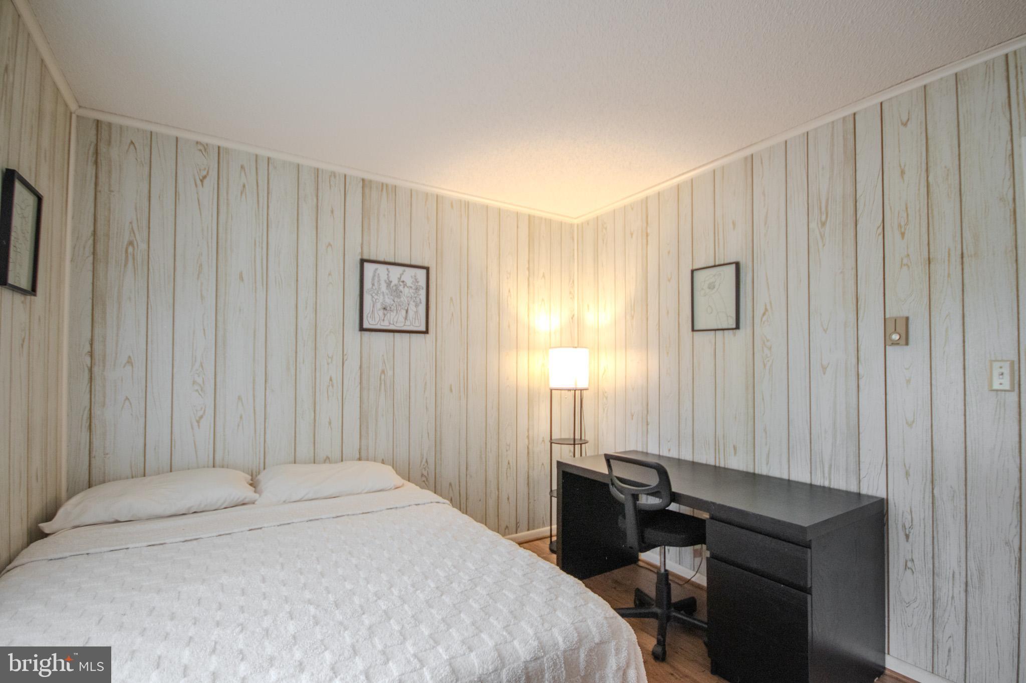 7218 Walston Switch Road Parsonsburg, MD 21849 - Photo 12 of 28 a bedroom with a bed and a furniture