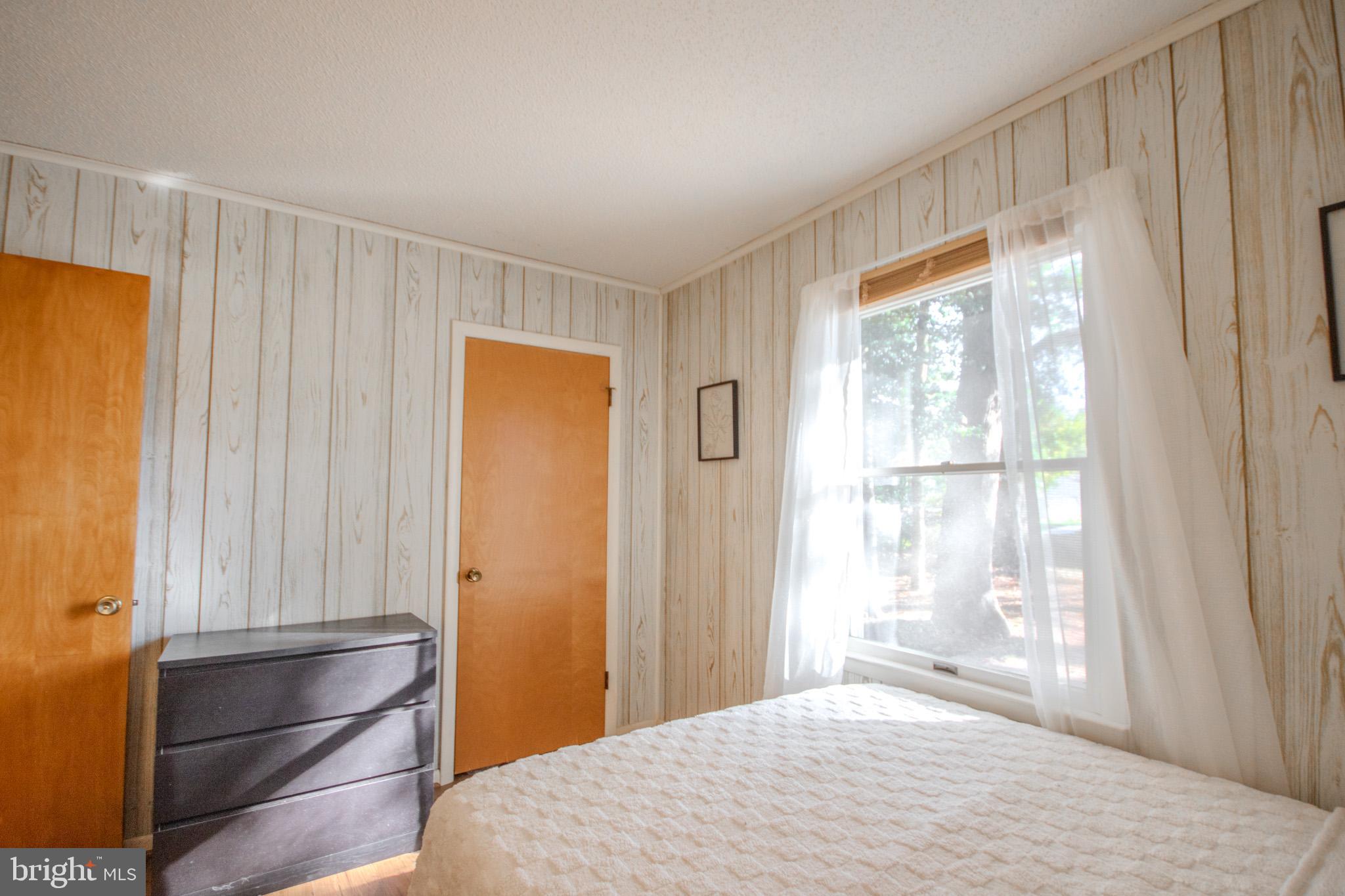 7218 Walston Switch Road Parsonsburg, MD 21849 - Photo 13 of 28 a bedroom with a bed and a window