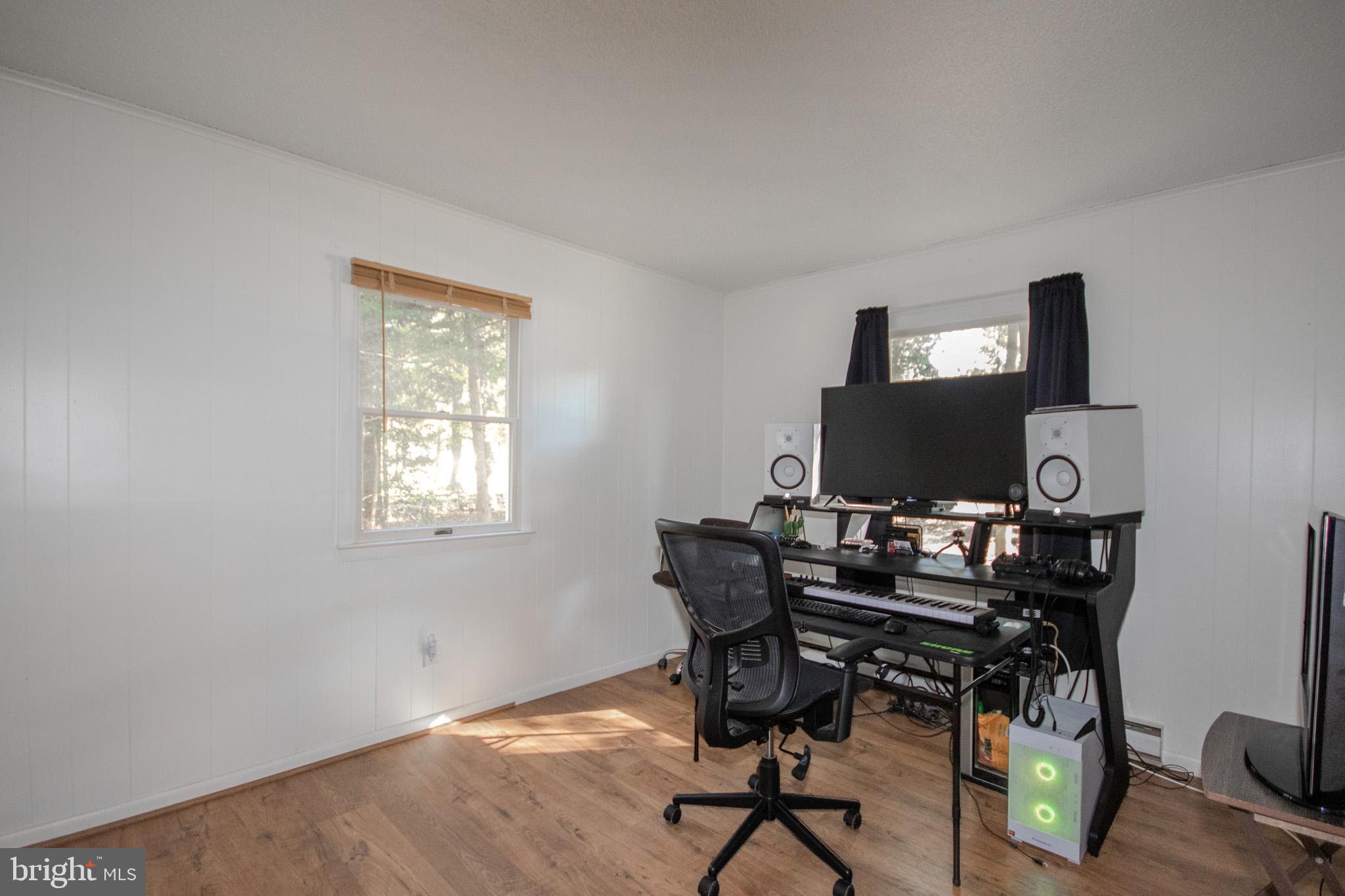 7218 Walston Switch Road Parsonsburg, MD 21849 - Photo 17 of 28 a view of a workspace with furniture and a window