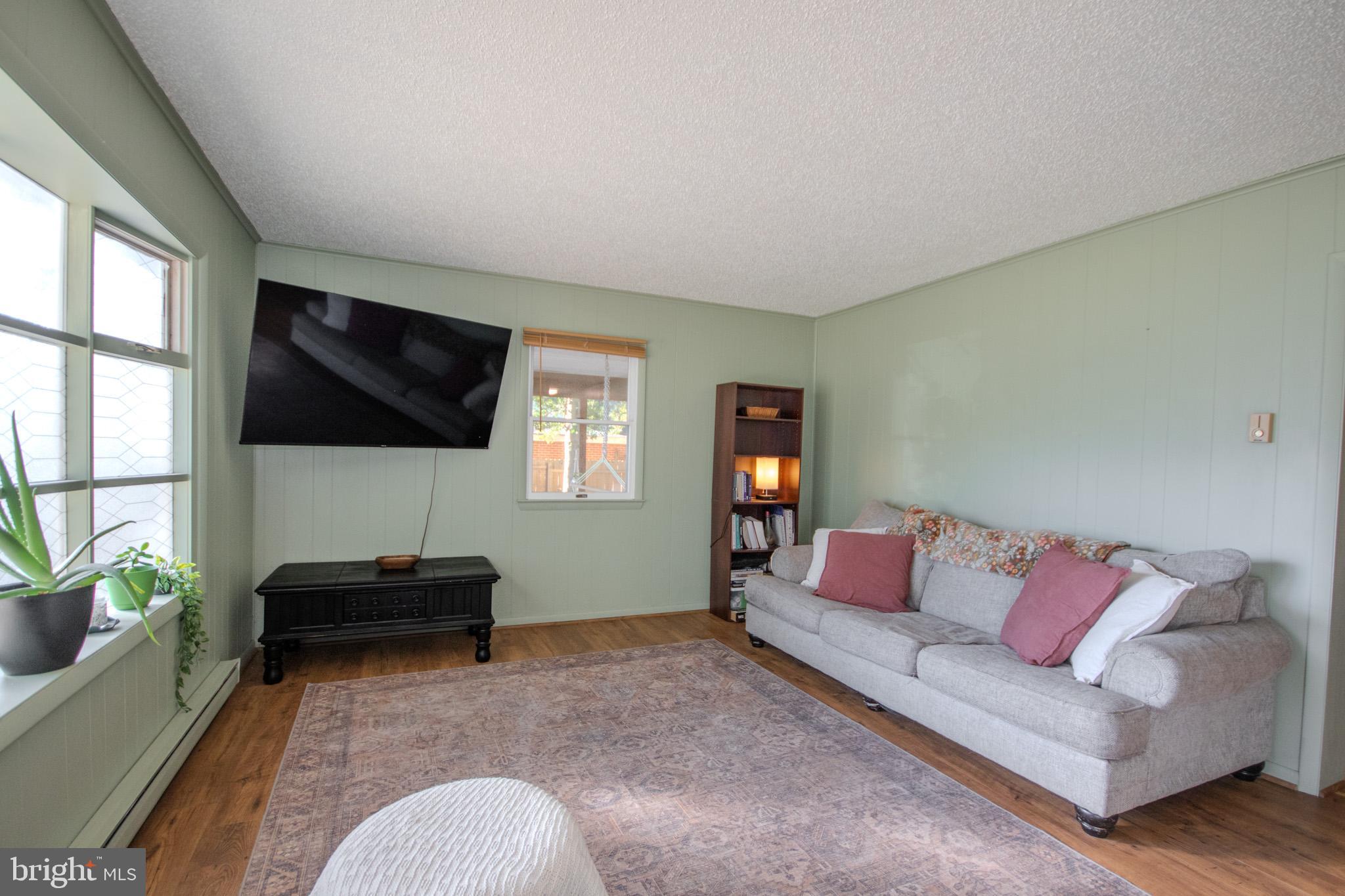7218 Walston Switch Road Parsonsburg, MD 21849 - Photo 4 of 28 a living room with furniture and a flat screen tv
