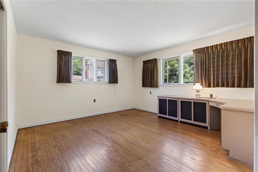 51 Reynolds Road Tamaqua, PA 18252 - Photo 31 of 71 Warm hardwood floors and abundant natural light create an inviting atmosphere in this versatile room.