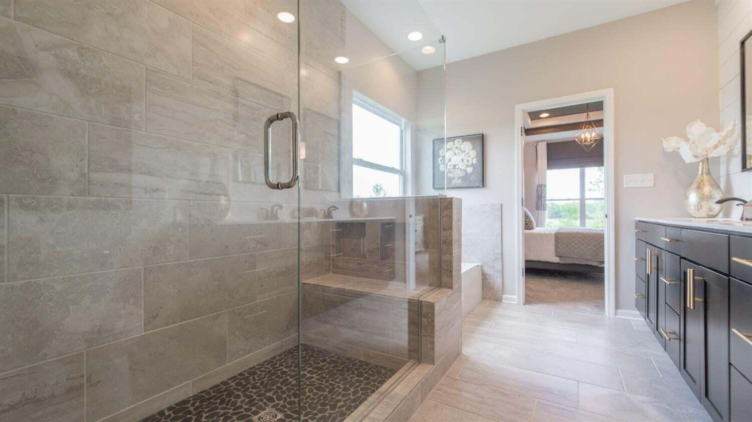 3098 Fawn Lane Portage, IN 46368 - Photo 17 of 22 a en suite bathroom with a glass shower door and a sink