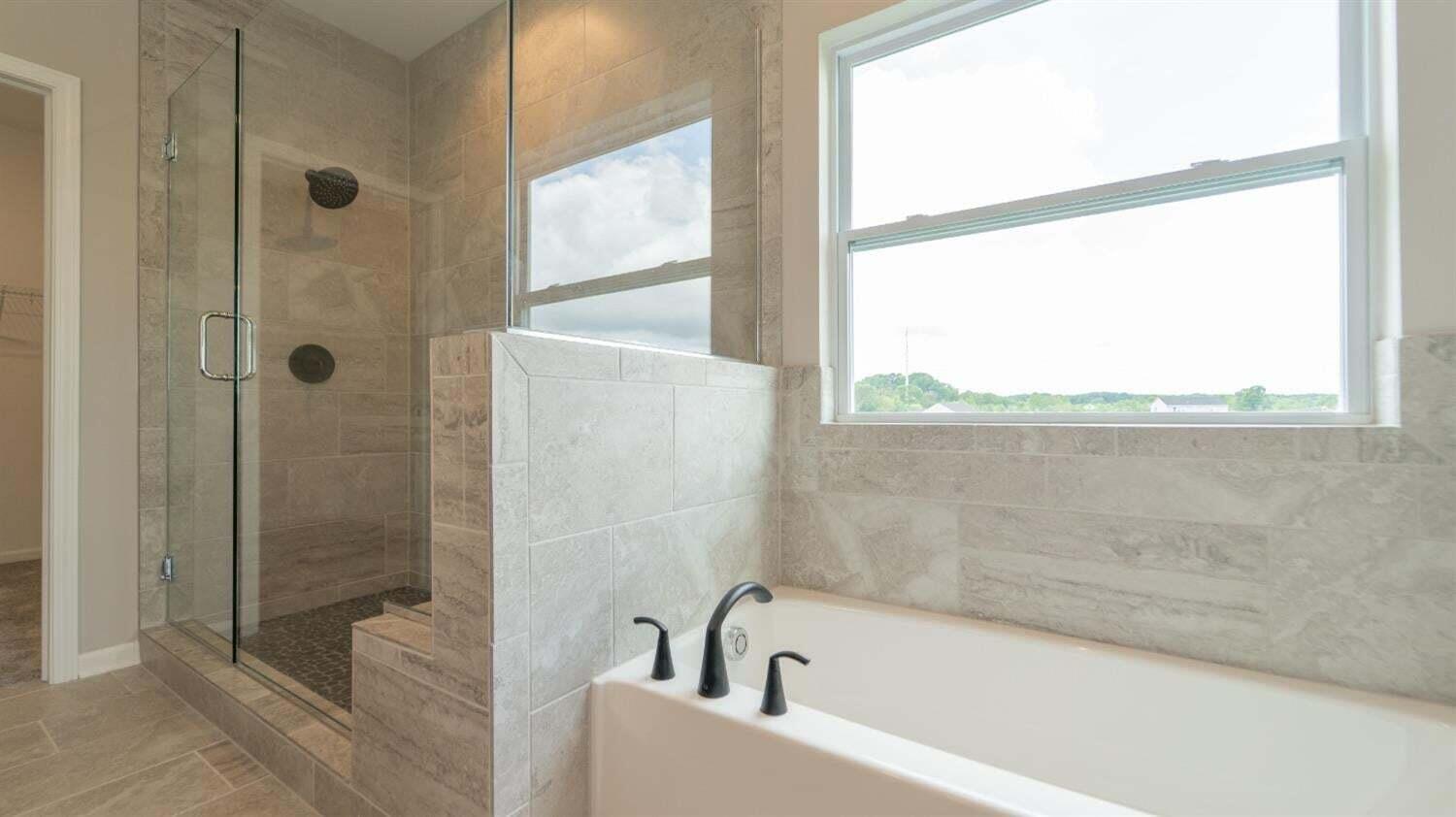 3098 Fawn Lane Portage, IN 46368 - Photo 18 of 22 a bathroom with a bathtub and shower