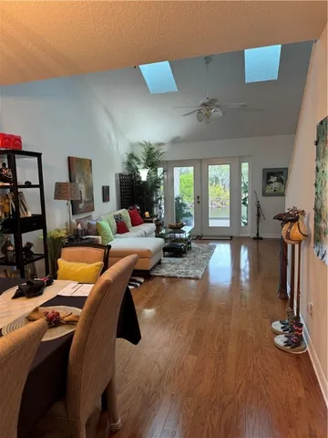 a room with lots of chairs and wooden floor