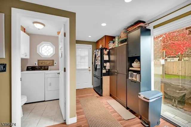 a kitchen with stainless steel appliances granite countertop a refrigerator and a stove
