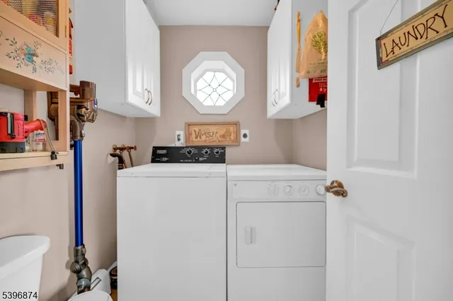 a hallway with a stove a washer and dryer