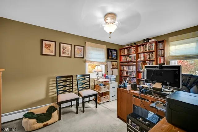 a room with furniture workspace and a window