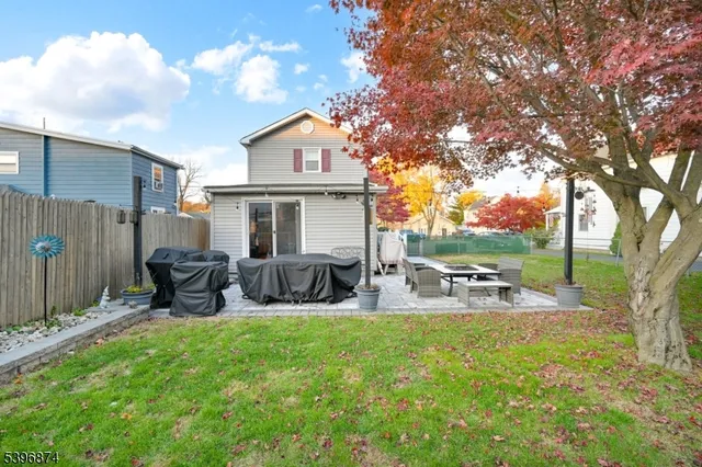 a view of a house with backyard porch and sitting area