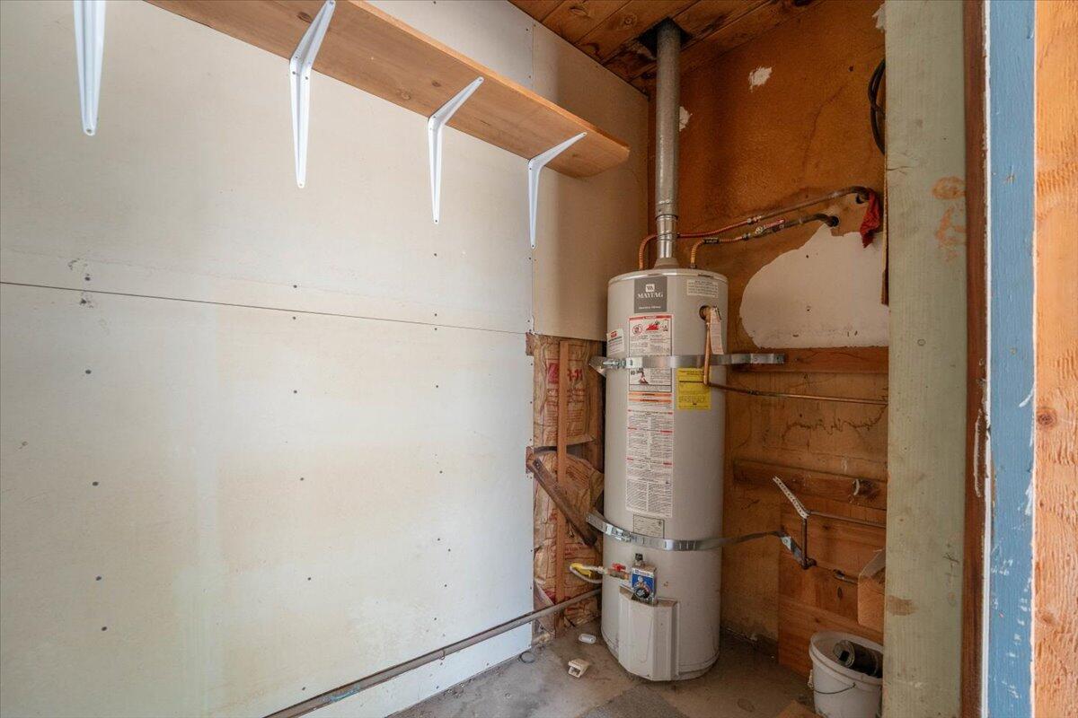 1865 Douglass Street Red Bluff, CA 96080 - Photo 22 of 24 a room with water heater and white cabinet