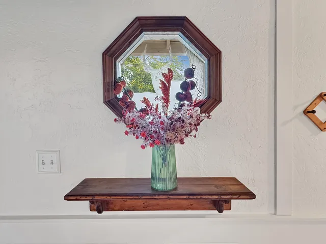 a vase of flowers sitting on a table
