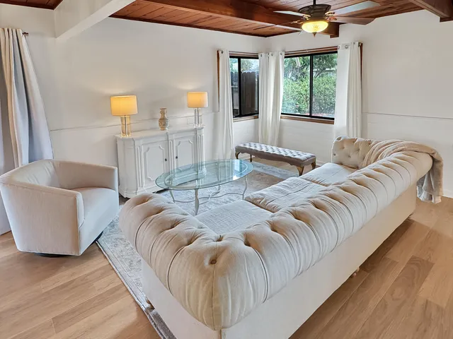 a bedroom with a bed and a couch