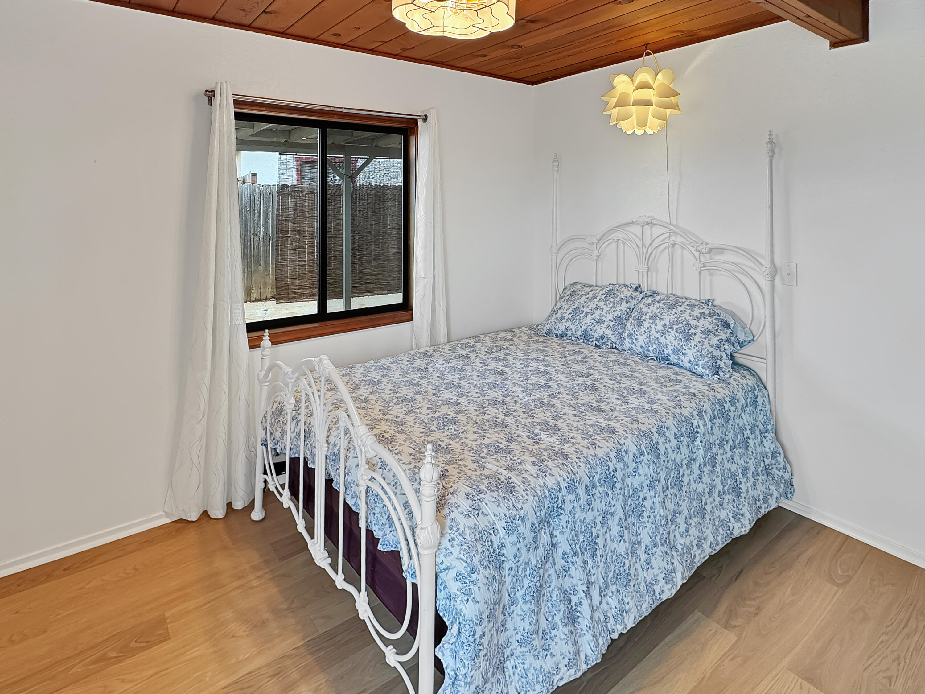 1865 Douglass Street Red Bluff, CA 96080 - Photo 10 of 24 a bedroom with a bed and a window