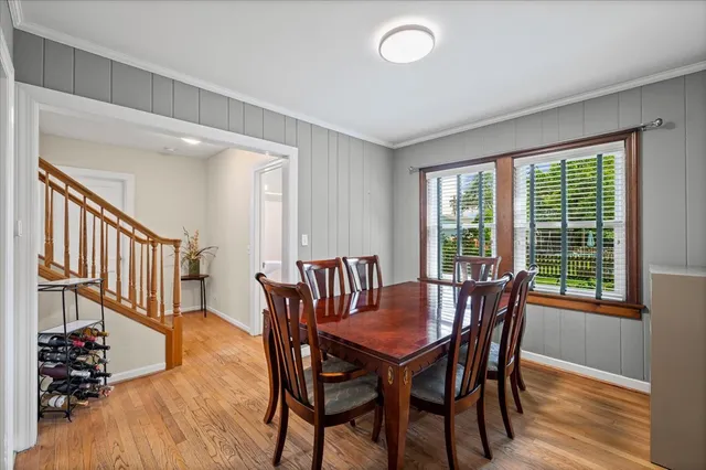 a view of a dining room with furniture window and wooden floor