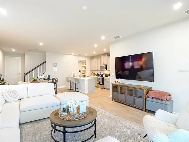 a kitchen with stainless steel appliances a sink stove and cabinets