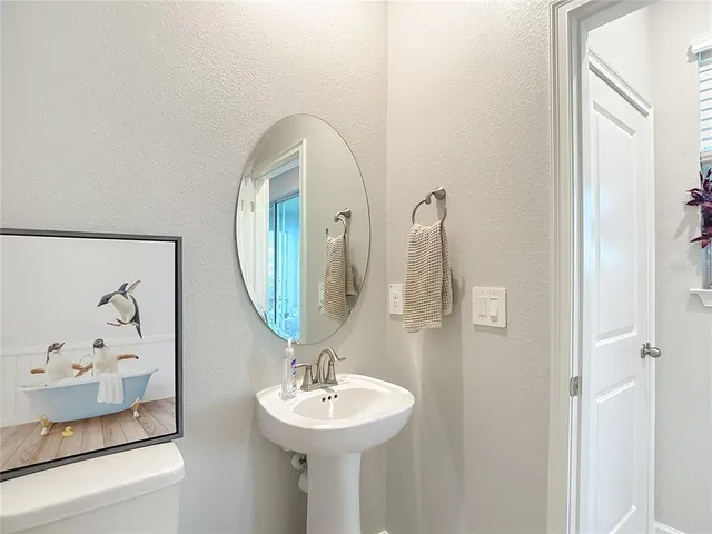 a living room with furniture and a chair