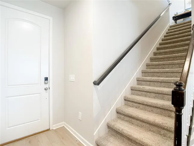 a kitchen with stainless steel appliances granite countertop a refrigerator and a stove