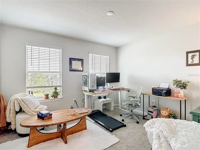 a workspace with furniture and a window