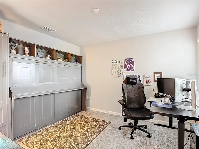 a bathroom with a shower curtain and a bathtub