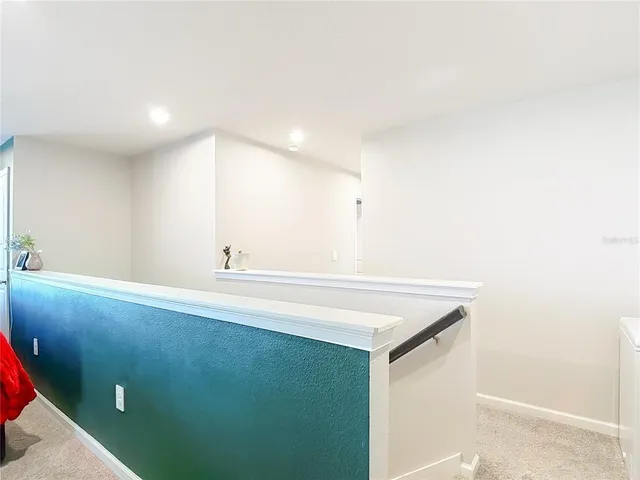 a bedroom with a bed and a mirror