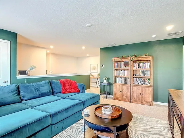 a view of walk in closet with clothes