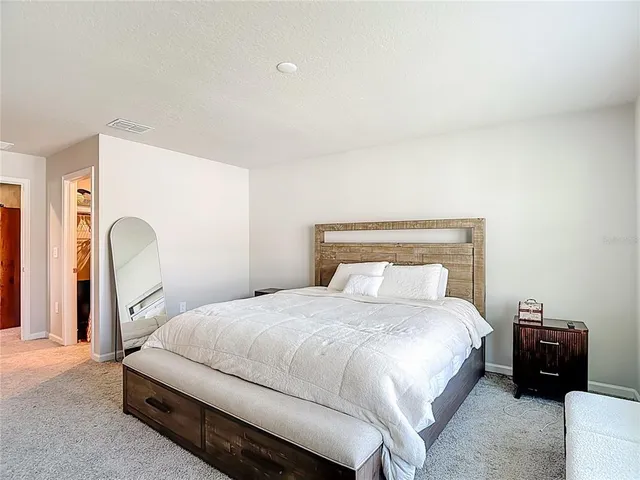 a dining room with furniture and floor to ceiling window