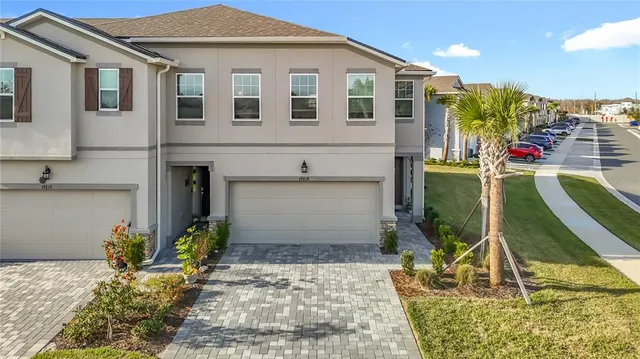 a view of a hallway with wooden floor and closet