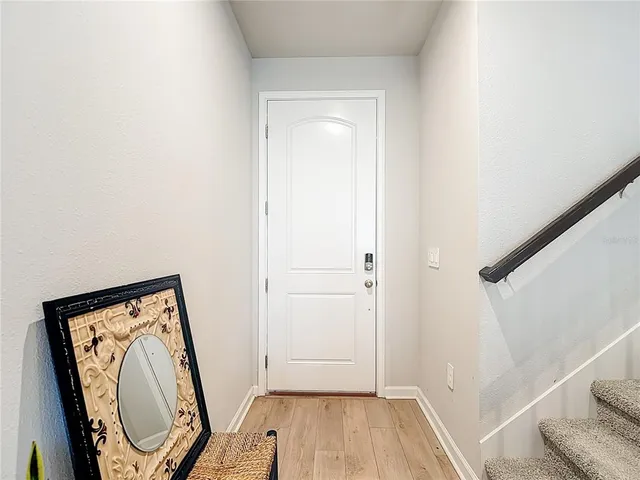 a dining room with furniture and a rug