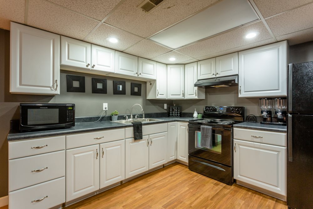 3841 Bull Run Road Penn Laird, VA 22846 - Photo 23 of 49 a kitchen with stainless steel appliances granite countertop a stove a sink and a microwave