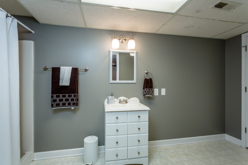 3841 Bull Run Road Penn Laird, VA 22846 - Photo 31 of 49 a bathroom with a sink mirror and vanity