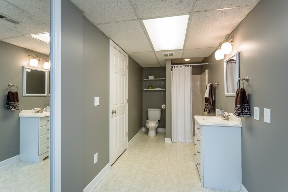 3841 Bull Run Road Penn Laird, VA 22846 - Photo 32 of 49 a view of a hallway with bathroom and wooden floor