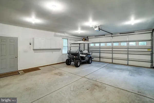 a bathroom with a sink and a washer dryer