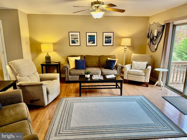 a living room with furniture and a lamp
