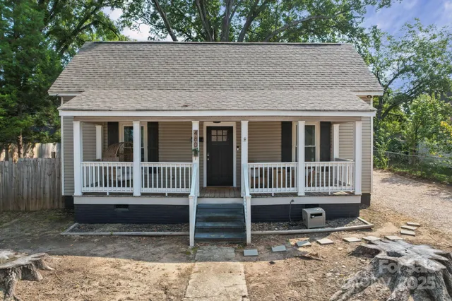 a backyard of a house with barbeque oven