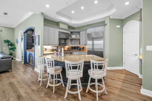 a room with wooden floor and shoes