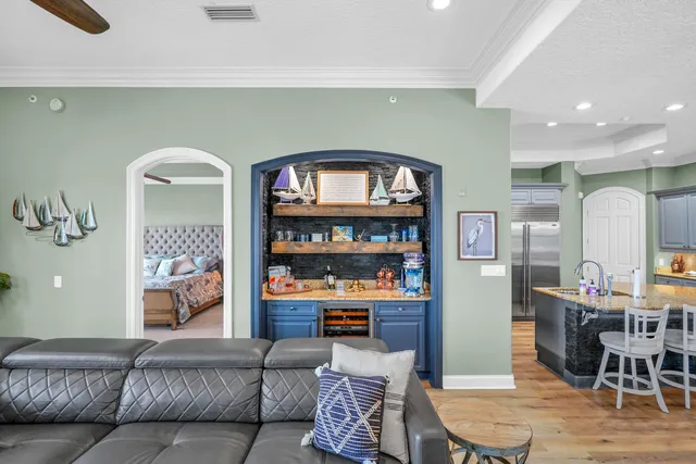 a living room with fireplace furniture and a wooden floor