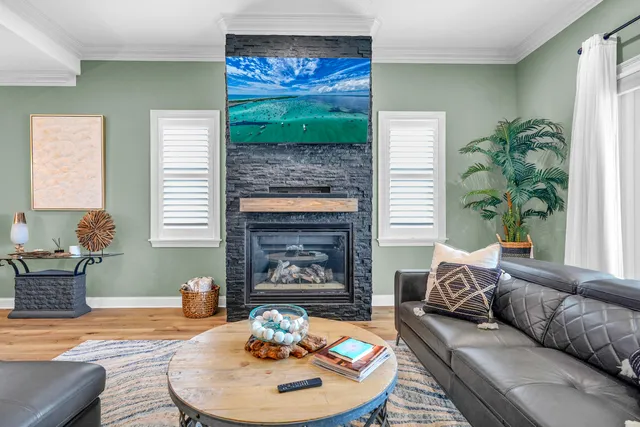 a bedroom with a large bed and a potted plant