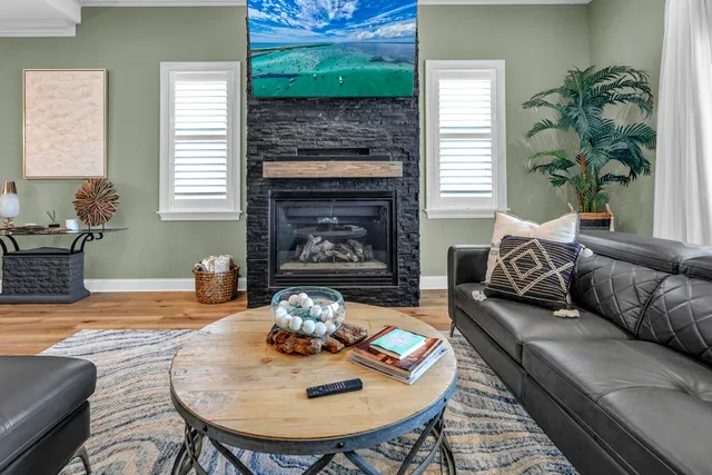 a bedroom with furniture and a large mirror