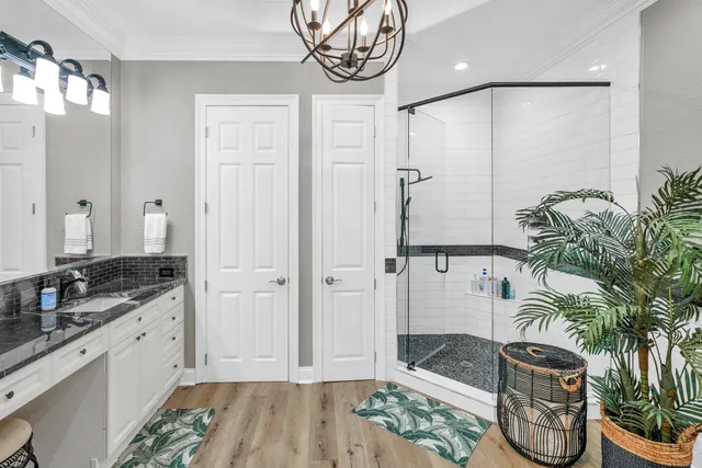 a front view of a building with plants