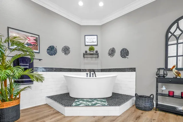 an aerial view of a house with swimming pool and outdoor seating