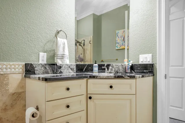 a bedroom with bed and a window