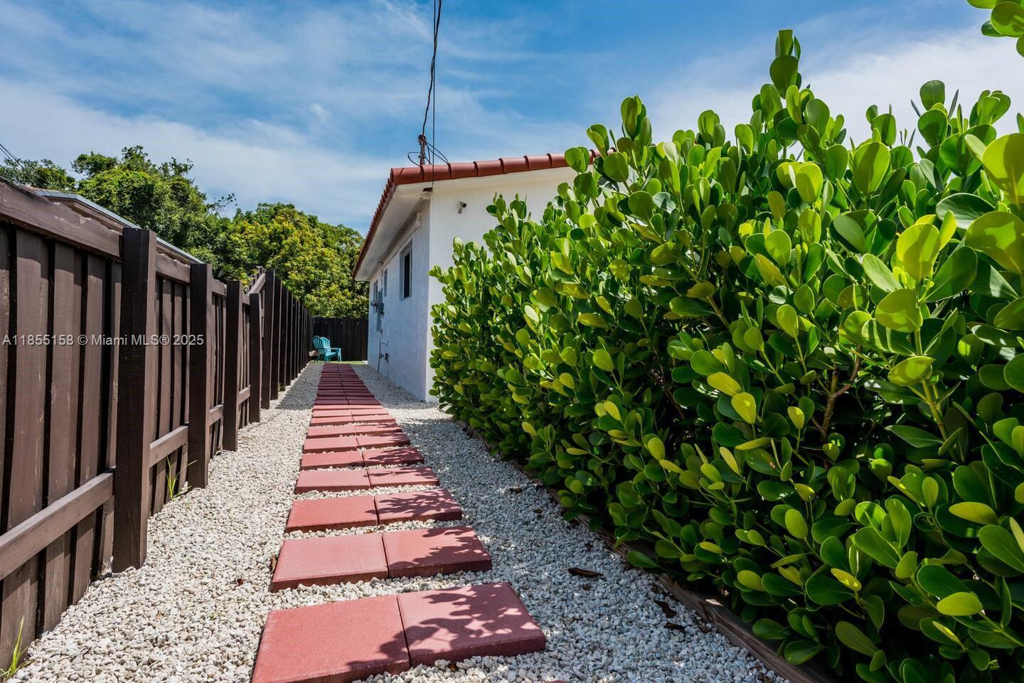 350 Northwest 50th Street Miami, FL 33127 - Photo 18 of 27 a view of a pathway in a garden