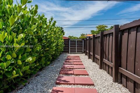 350 Northwest 50th Street Miami, FL 33127 - Photo 19 of 27 a view of a pathway with a backyard